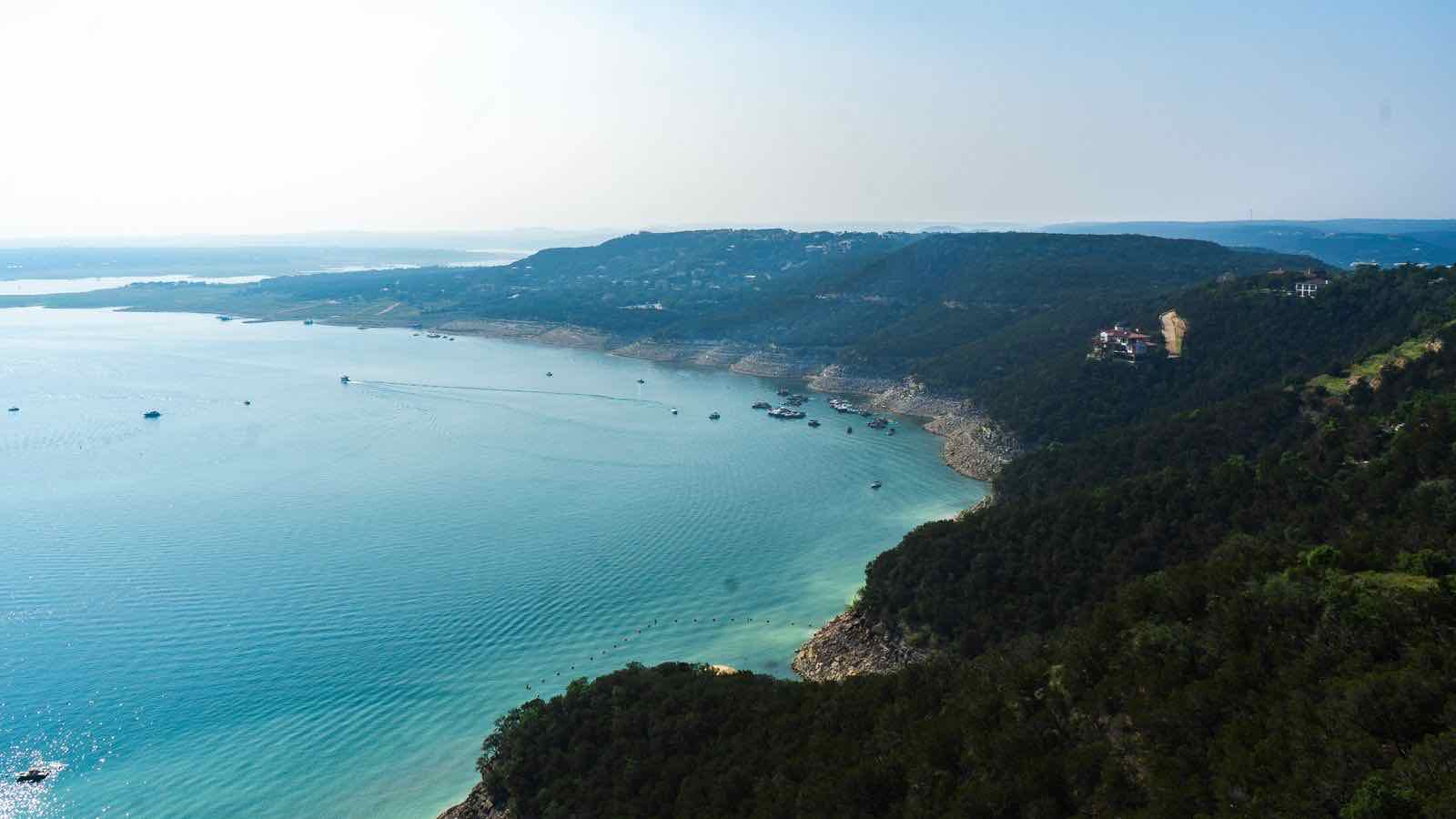 Aerial view of a lake among the hills of the Texas Hill Country.